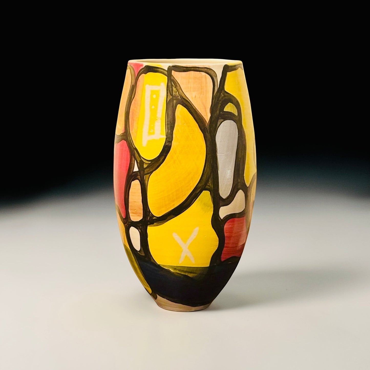 CeramicMeltdown.com Fjord vase with abstract stained-glass style pattern in yellow, red, and grey.