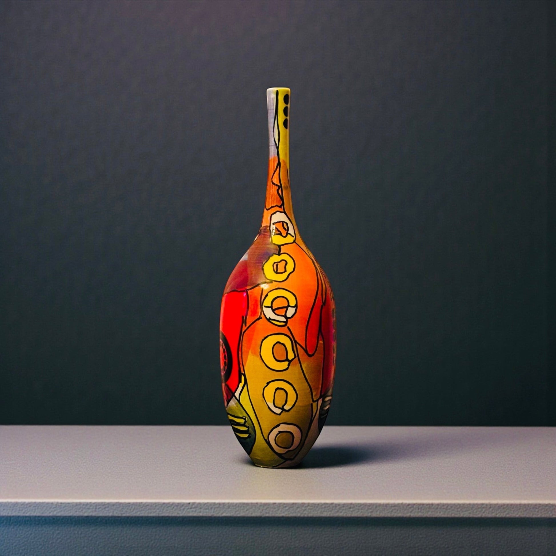 CeramicMeltdown.com Lensing vase with swirling red, orange, yellow, and turquoise abstract design. White ceramic stoneware.