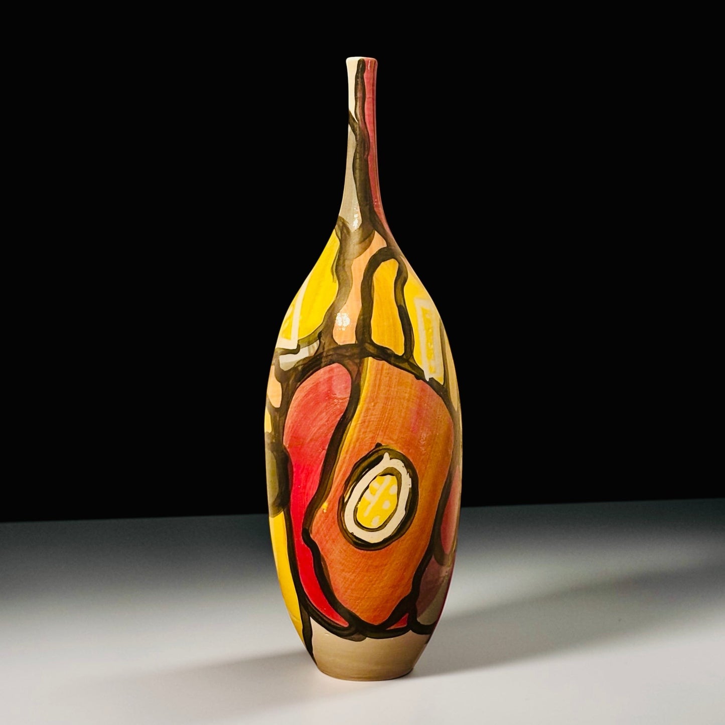 CeramicMeltdown.com Delta abstract art vase with bold red, orange, and yellow painted design.