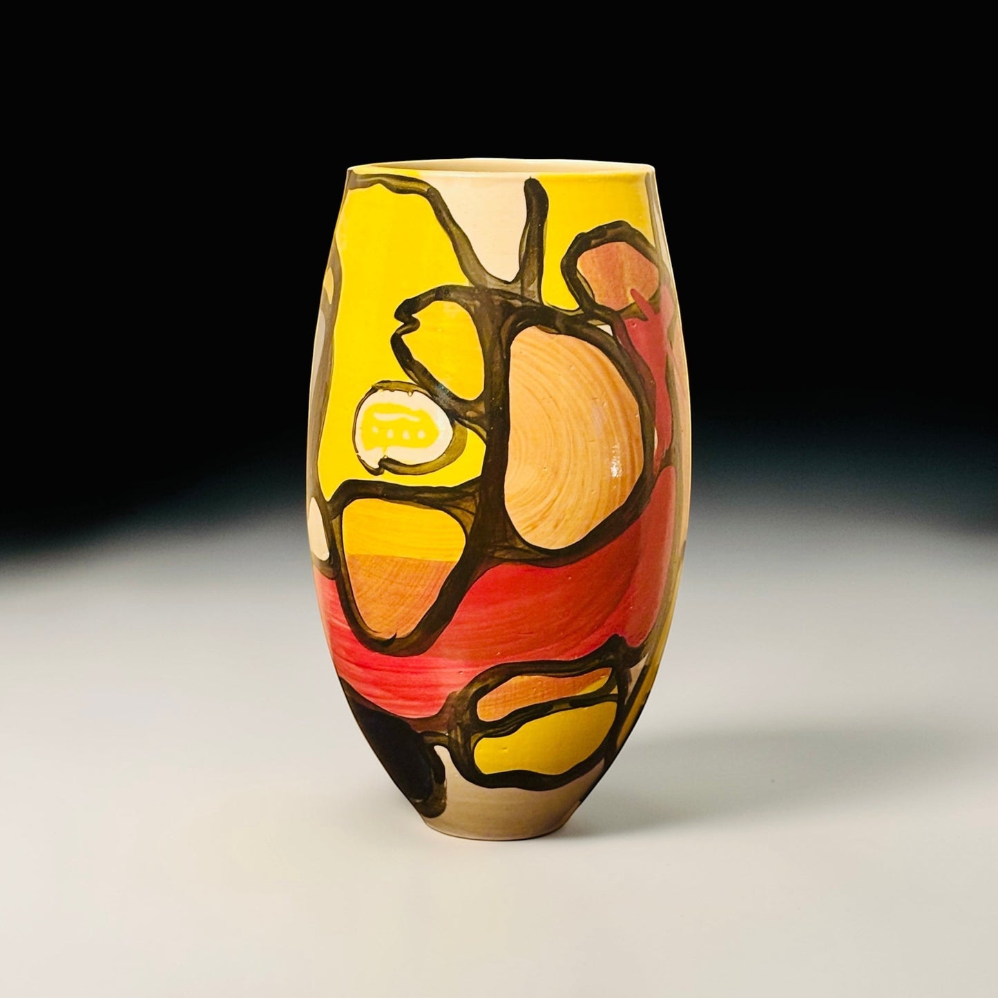 CeramicMeltdown.com Fjord vase with abstract yellow, red, and orange design. Ceramic material.