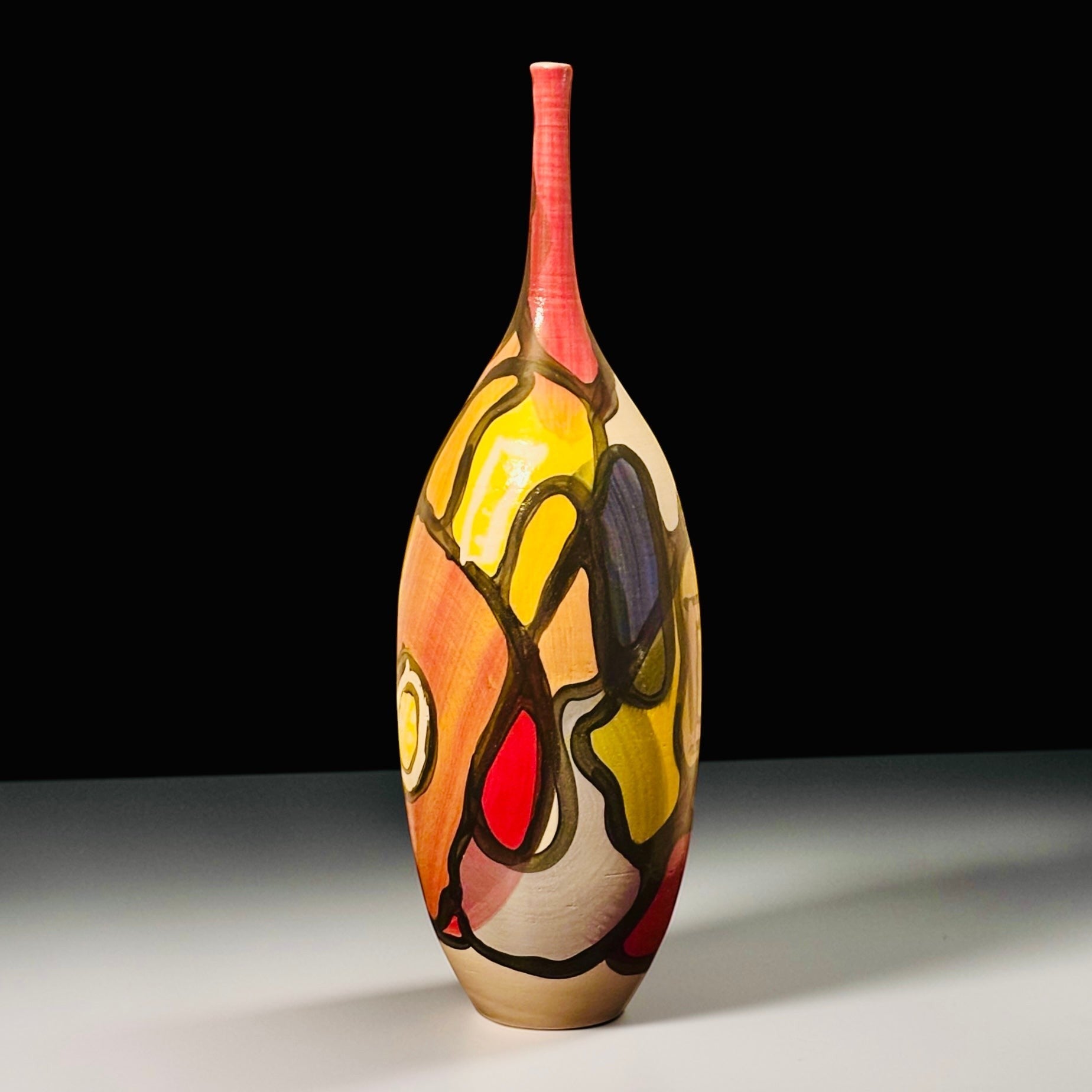 CeramicMeltdown.com Delta abstract art vase with red neck and colorful, stained-glass-like patterns.