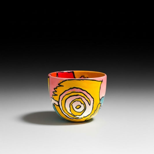 CeramicMeltdown.com abstract art wine cup with pink, yellow, red, and blue swirls.