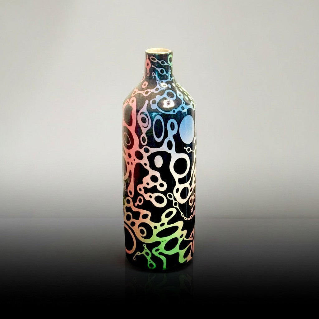 CeramicMeltdown.com handmade white ceramic bottle with ameba-like texture and rainbow gradient pattern. Narrow neck.