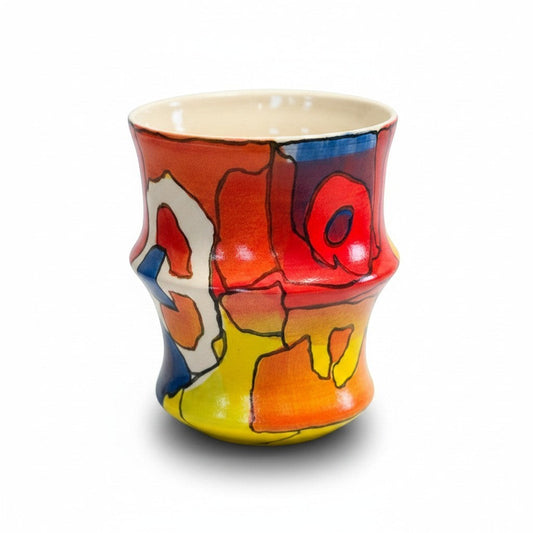 CeramicMeltdown.com hand-painted ceramic tumbler with abstract colourful design in red, orange, yellow, blue and white.