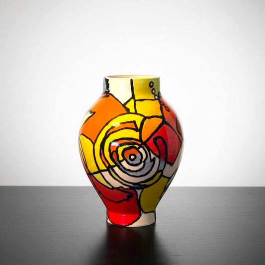 CeramicMeltdown.com abstract expressionist moon jar with bold red, orange, yellow, and blue geometric shapes and black outlines.