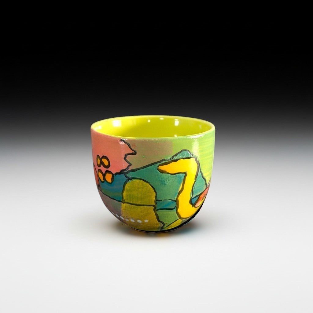CeramicMeltdown.com abstract art wine cup with yellow interior and colorful painted exterior.