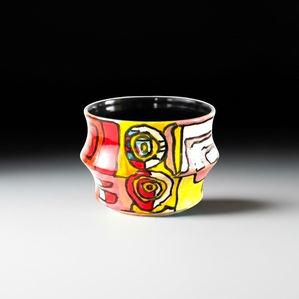 CeramicMeltdown.com hand-painted ceramic cup with abstract red, yellow, and white art. Unique design.