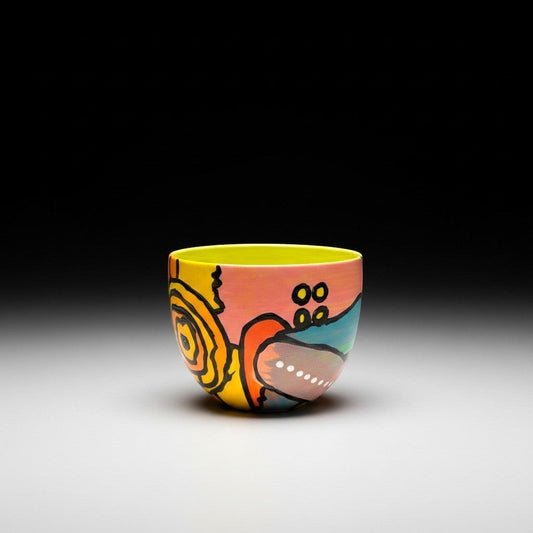 CeramicMeltdown.com abstract art wine cup with yellow interior, pink and blue exterior, and black line details.