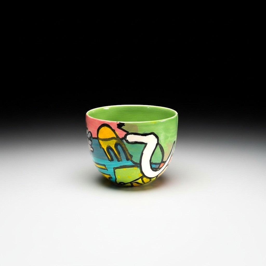CeramicMeltdown.com abstract art wine cup with green interior and colorful exterior design.